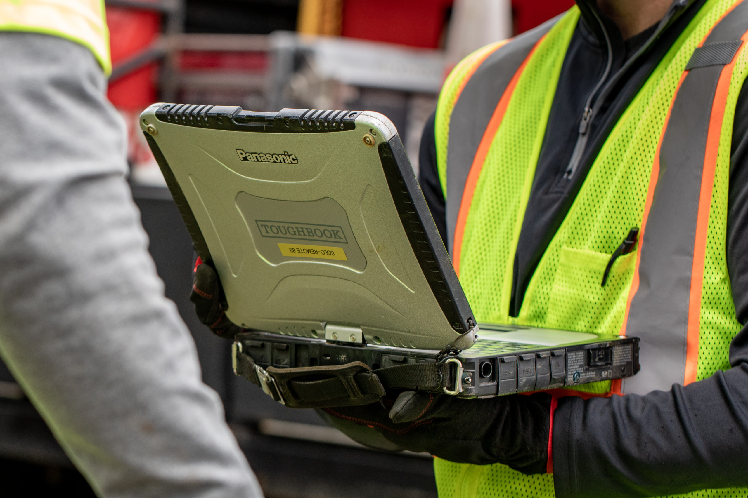 Field technicians reviewing sewer asset management data