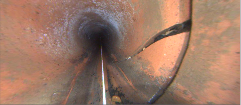Interior of a pipe with a large crack at the 3 o'clock position