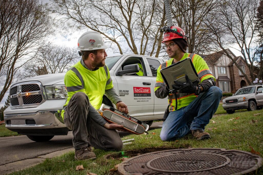 RedZone Robotics team conducting a sewer pipeline inspection with SOLO robot